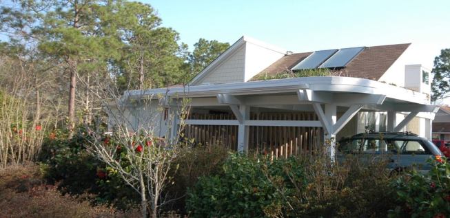 A green roof on top of the new carport collects rainwater.