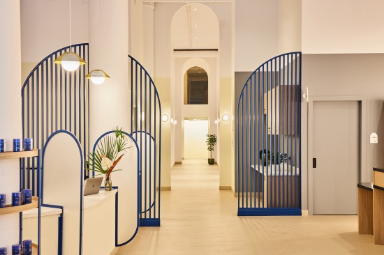 The reception area and waiting room for the flagship location of HealthQuarters, a health care start-up in New York, make it clear that this isn't your traditional doctor’s office. Slatted screens demarcate different program areas in the three-story project, and white-oak millwork and curved accents help create an inviting atmosphere.