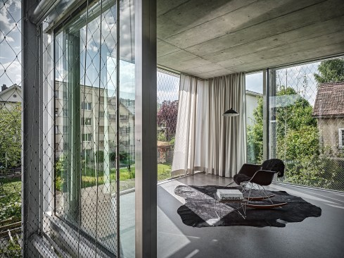 Every other window in the façade opens for natural ventilation, and is protected by a fixed screen of wire rope.