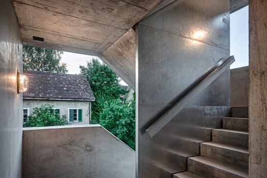 An open-air staircase on the northwest corner provides access to each unit.