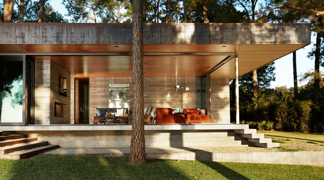 Sliding glass doors from Fleetwood open common spaces, like the family room on the house’s northeast side, to the outdoors.