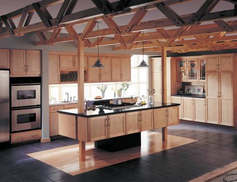 Trend #11: Shaker-style Merillat Classic cabinets in maple provide a simple complement to the dramatic exposed trusses in this rustic kitchen.