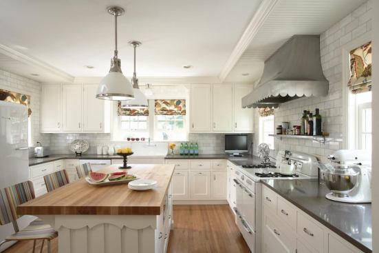 Trend #6: The scallop-edge vent hood capping the vintage stove in this kitchen designed by Rehkamp Larson Architects sets a whimsical tone and is anything but ordinary.