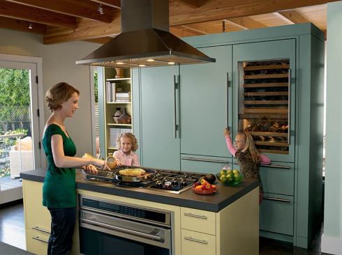 Trend #7: A colorful “tall wall” loaded with built-in SubZero appliances doubles as a wall partition, blending function with flavor.