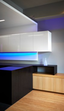 Multiple storage units by Potomac Woodwork provide work as definitive design elements and counter top space.