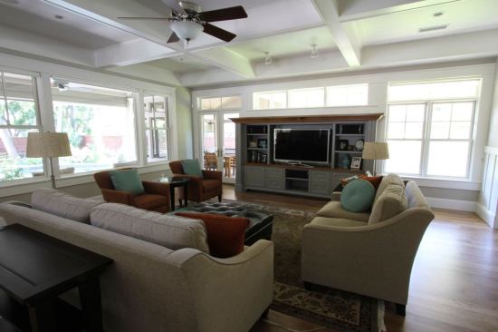 The large windows with deep roof overhangs were sized to provide summer shading yet allow for ample daylighting and natural winter heating from the sun.