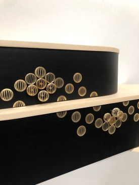 The Astral console, designed by Studio Line & Raphaël marries the timeless charm of marquetry with new technologies like 3D printing. The marriage of brass and laser-cut black pear wood veneer creates a visually captivating combination, bringing elegance and refinement to any interior space.
