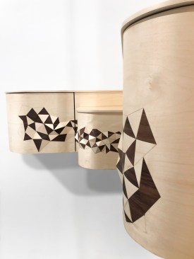 Polygonal Corner Furniture, by Studio Line & Raphaël, uses 3D modeling, digital cutting and 3D printing allowing the designers to push the limits of traditional marquetry whereby the wood veneer pattern gradually takes on relief and comes to life.