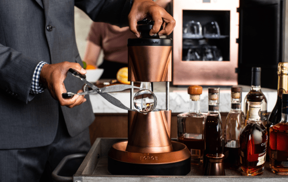 The perfect ice cube. Monogram demonstrates how a new specialty product will deliver an unmatched sipping experience via the Forge heated sphere ice press. A product of FirstBuild, the innovation incubator and co-creation community of GE Appliances, Forge was designed for use in the homes of bourbon connoisseurs and by professional bartenders and mixologists. (Monogram Design Center Chicago, Suite 124)