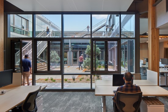 2021 AIA COTE Top Ten winner Microsoft Silicon Valley Campus, Mountain View, Calif., designed by WRNS Studio. The renovated and expanded 643,000-square-foot project features an occupiable living roof and a series of courtyards that ensure every desk is within 25 feet of nature. Located in a drought-ridden region, the project includes water-management strategies that help support a natural habitat and public trail beyond the site.