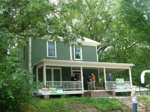 To remodel this 1910 home in downtown Durham, BuildSense deconstructed several apartment additions, raised the house 8 inches, and gutted the interior. They then added a new foundation, reframed portions, insulated the walls and roof, and opened up the first-floor layout.