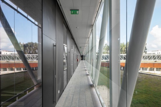 Glazed hallway on second floor with view to central plaza