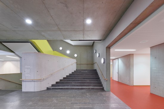 Concrete stair in connecting volume