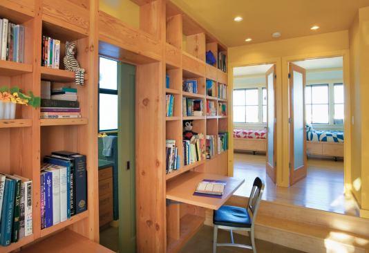 The kids’ bedrooms are compact and an adjacent hallway with a flip-down desk provides homework space.