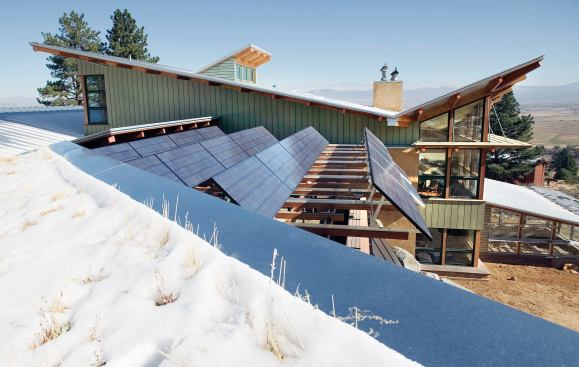 The straw bale Johnson residence in the Sierra Nevada Mountains is virtually free of the power grid. Upturned roofs collect sunlight and offer views of Job’s Peak.