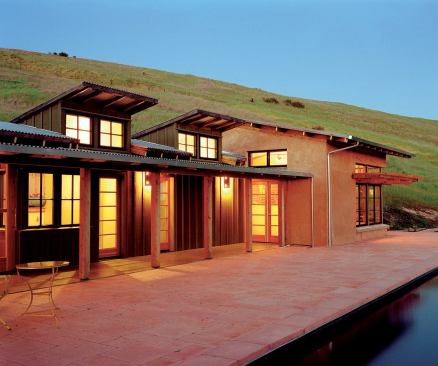 The 18-inch-thick main walls of this vacation compound in Sonoma County are made from rammed earth. Smaller buildings house the bedrooms and baths.