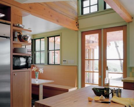 A 3-inch-thick bowling lane tops the kitchen island; old glass bottles form the bathroom counter.