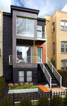 The remodeled exterior of the home repeats the same design elements of color and defining materials.