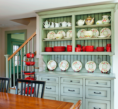 Remodeler Halsey Platt also exposed the bottom five treads to the left of the hutch to create a more open feel. The judges appreciated the unifying effect created by painting the stair balusters the same base green color as the hutch.