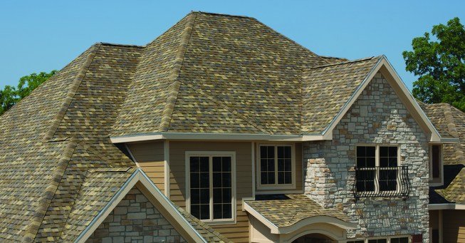 Owens Corning's Duration Designer shingles in Sand Dune, the Owens Corning 2018 Shingle Color of the Year.