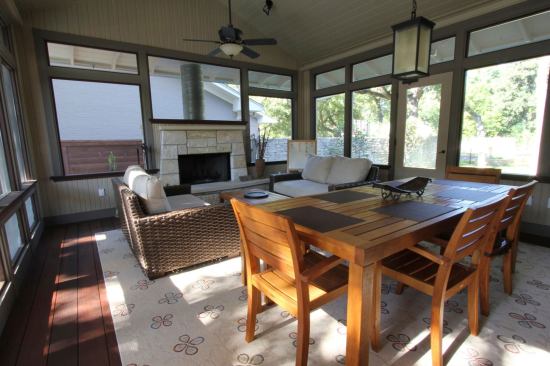 The screened porch captures southeasterly breezes that are then drawn through the home and exhausted at a skylight over the second-floor catwalk and the windows in the stairwell.