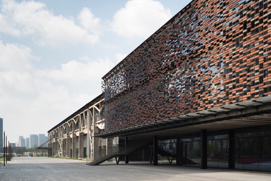 Brick screen over glazing by one of the new main entries on the south façade