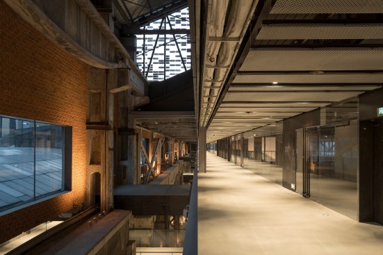 Exposed structure is visible throughout the renovated interior