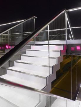 A detail of the illuminated staircase and the recessed LED video display.