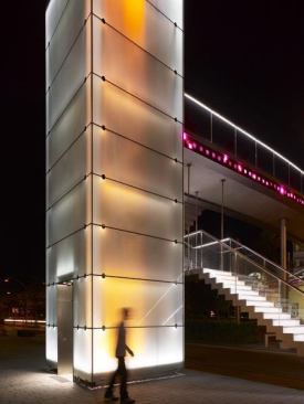 Passers-by can playfully interact with the towers transforming the static light towers into a dynamic light installation.