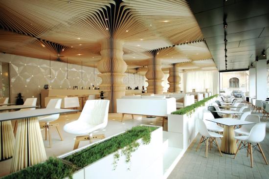 Graffiti Café opens onto the street, and the lower tier of seating features a floor of sidewalk pavers to create a natural transition for pedestrians arriving for a meal. 