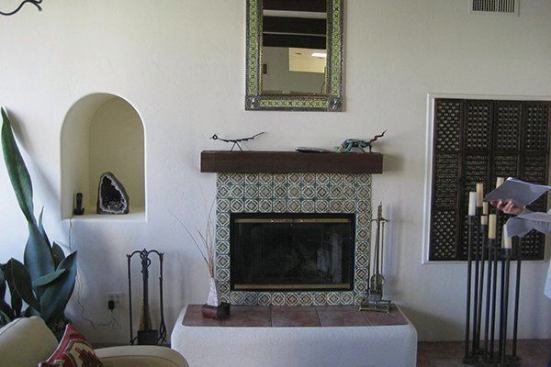 The fireplace in the existing living room.