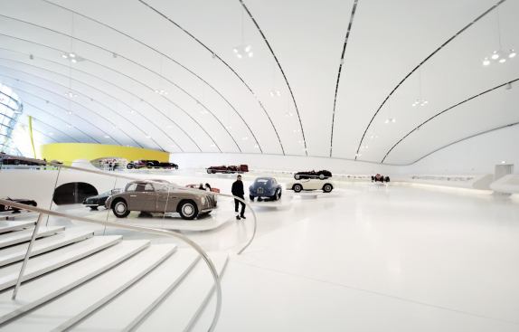 The exhibit floor slopes down more than 16 feet, and specially designed stands elevate the cars 1.6 feet above the ground.