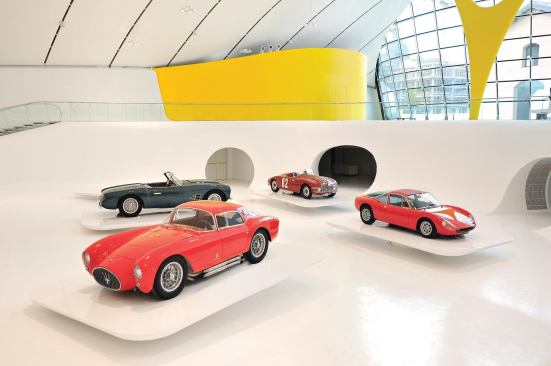 Cars showcased in the exhibition area.