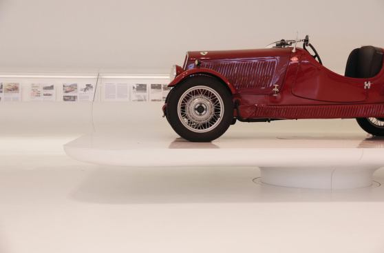 Each car sits on a custom-designed podium, allowing it to hover over the ground plane.