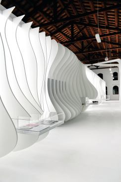 Inside the Ferrari House next door to the new Future Systems building is a double-height exhibit space designed by one of the firm’s former associates, Andrea Morgante of Shiro Studio.