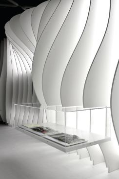 A finned structure houses projectors for multimedia displays.