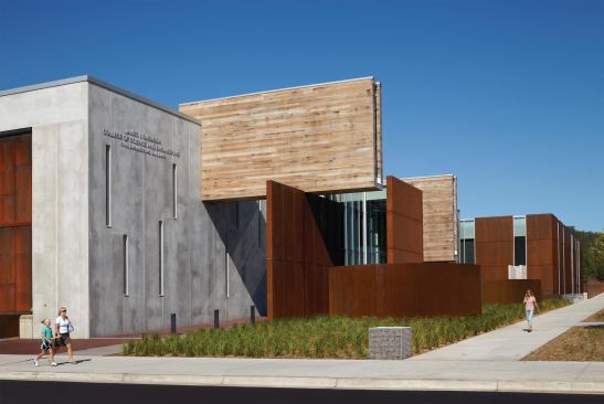 Exterior with view of Cor-Ten drains and recycled-pickle-barrel scuppers