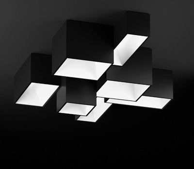Link, Vibia
The Link lighting system, designed by Ramon Esteve, is a series of four different-sized square and rectangular modules with a matte white or charcoal-gray finish that can be joined in any configuration for a wide variety of ceiling silhouettes. The modules range in length from 45 inches long to 15 3/4 inches wide. The modules can connect on any of their four sides and simply require that there be a 5 1/2-inch overlap of surface area. A single electrical connection can support up to eight modules. Link is fully dimmable using a zero-to-10V electronic dimming ballast, has a polycarbonate diffuser, and uses two, 2G11 lamps from 18W to 40W, depending on the size of the module selected.
vibialight.com