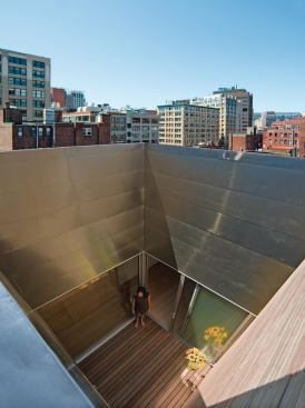 The courtyard opens up to the sky and brings light deep into the loft.