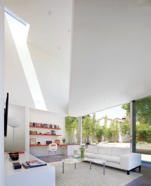 No air conditioning needed: Large windows, sliding glass doors, and motorized skylights combine to maximize natural ventilation. Low-E glass and the form of the second story help to regulate the daylight and heat entering the office and living room. While energy performance will be monitored for three years, EnergyPro analysis predicted the building will perform 25.2 percent better than 

2008 California residential energy standards.