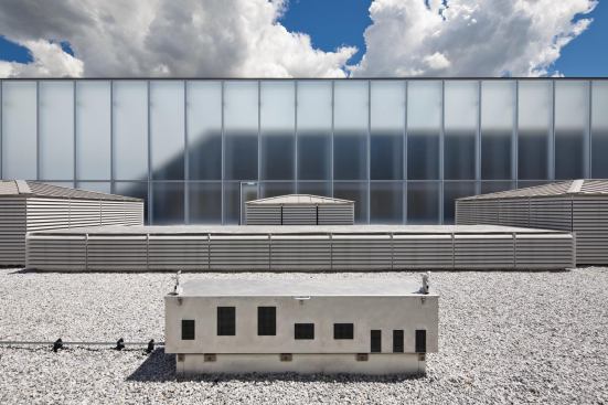 A sensor on the roof—built as a miniature scale-model of the building—reads the galleries’ light 

levels so that shades can be raised and lowered as needed.