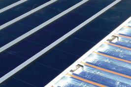 The Solar Sandwich roofing system contains a solar thermal system in an otherwise ordinary roofing system.