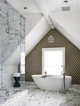 The master bathroom on the uppermost floor has a freestanding tub and enclosed shower. Client developer Lindsay Chambers wanted Feldman to create a space that might work for families as well as singles in this San Francisco market.