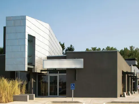 Brown's first foray into strip-mall design and development was 120 Blondo, an office/retail center completed in 2004 and listed in The Phaidon Atlas of Contemporary World Architecture. Like all of Brown's malls, it is fully leased.
