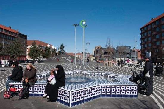 A fountain in the Black Market area of Superkilen, with skate ramp in the background.