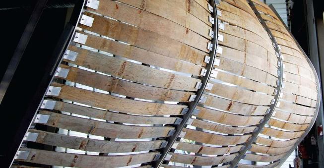 Used as a finish material, for instance in the sunscreen on the proprietor's house, shown here in mock-up (5), staves were also the inspiration for the patterning of the concrete on the interior walls of the barrel-aging rooms in the winery building. With a digital file that took the basic form of a barrel stave, the pattern was routed into a specific mixture of cast concrete, resulting in seamless panels (4).