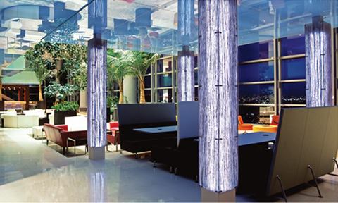 Sophisticated interiors in the cafeteria, winter garden, and elevator corridors provide a decorative counterpoint to the open office areas where a comprehensive daylight harvesting control system keeps the space illuminated by night and day.