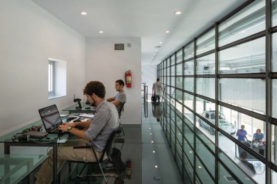 Second-floor workstations overlook the main research bay.