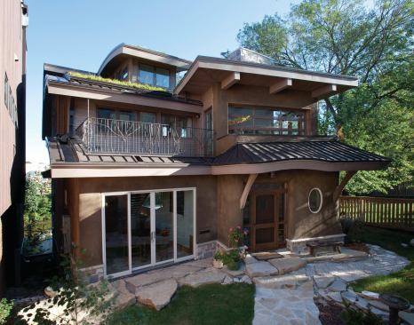 The house is built on a brownfield site in the Kane Commons community, which includes 12 living units surrounding a common courtyard. With careful grading, the need to landfill contaminated soils was greatly reduced.
