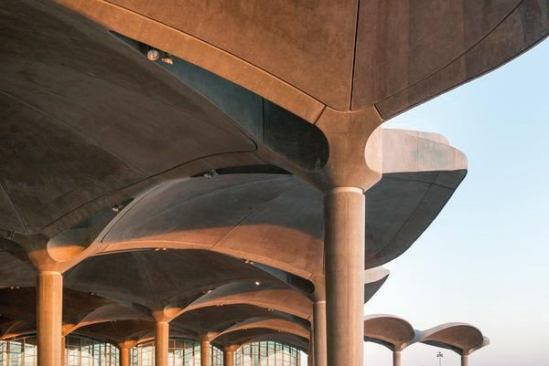 Along the perimeter of the new Queen Alia International Airport building, precast concrete shade structures catch the light. The team chose concrete because “in summer there is a marked difference in climate between day and night in Amman, so the solid structure helps to regulate the interior temperature naturally,” says Foster + Partners partner Jonathan Parr.